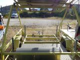 a yellow trailer that is parked on the side of the road