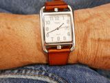a close up of a person ' s wrist with a watch on it