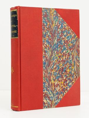 a red book with a floral design on the cover