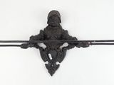 a black iron wall hook with a bird on it