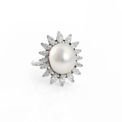 a white pearl and diamond ring