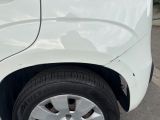 a close up of a car ' s tire on the street