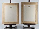 pair of wooden easels with a mirror on top of them