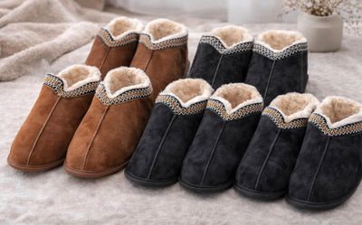 four pairs of women ' s sheepskin slippers on a bed