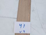 a close up of a piece of wood with a sticker on it