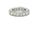 a close up of a diamond ring on a white background