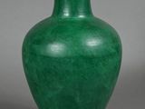 pair of green vases on a grey background