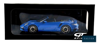 the blue car is in a black box on a white background