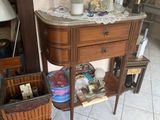 a small table with a basket on top of it