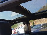 a view of the sunroof of a car from inside