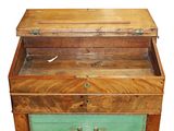 an old wooden chest with two drawers on top of it