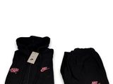 a pair of black sweatpants with pink nike logo on them