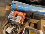 a box of screws and a box of nails on a pallet