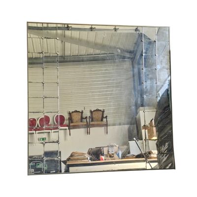 a mirror that is hanging on the wall in the kitchen