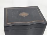 a black box with a gold decoration on it