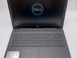 the dell laptop is open and ready to be used