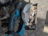 two tools that are sitting on a metal floor