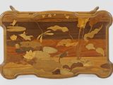 a wooden tray with flowers and leaves painted on it