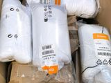 many rolls of white toilet paper in a cardboard box