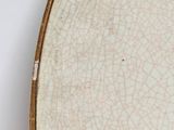a white plate with a cracky design on it