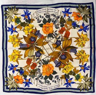 an image of a square scarf with flowers and leaves on it