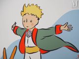 a cartoon picture of a little boy with a cape on