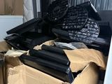 a cardboard box filled with assorted items in a storage area