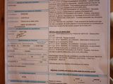 a sheet of paper on a wooden table with a teddy bear