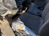 the interior of a vehicle with a broken steering wheel and a broken steering wheel