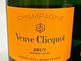 a bottle of champagne next to a bottle of wine