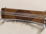 a picture of a wooden rack with a coat rack attached to it