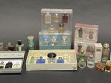 many different types of perfumes in a display case