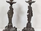 pair of antique cast iron candlesticks in the form of flowers and leaves