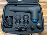 a black case with a blow dryer and other items in it