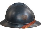 a helmet with a leather strap on it
