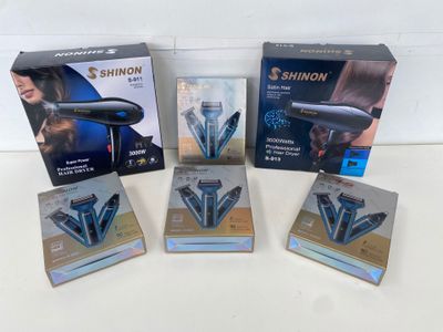 four different types of hair dryers in boxes on a table