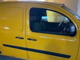a yellow van that is parked in a garage