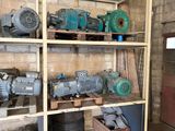 many different types of motors on the shelves in the room
