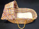 an image of a wicker basket with a blanket on top of it