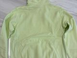 neon green hoodie on a marble table in a living room