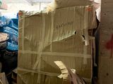 a pile of boxes and other items in a room