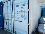 a white shipping container sitting next to a blue container