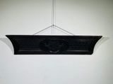 a black plaque hanging on the wall of a room