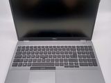an open laptop computer sitting on top of a white table