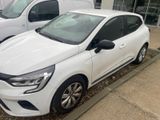 a white car that is parked in front of a building