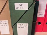 a lot of binders on a shelf with labels on them