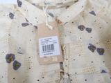 a picture of a shirt with a tag on it