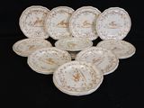 a lot of plates that are sitting on a black table