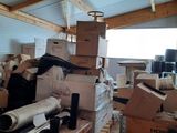 a room filled with lots of boxes and other items