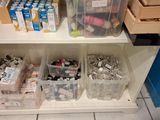 two bins filled with assorted items on a shelf